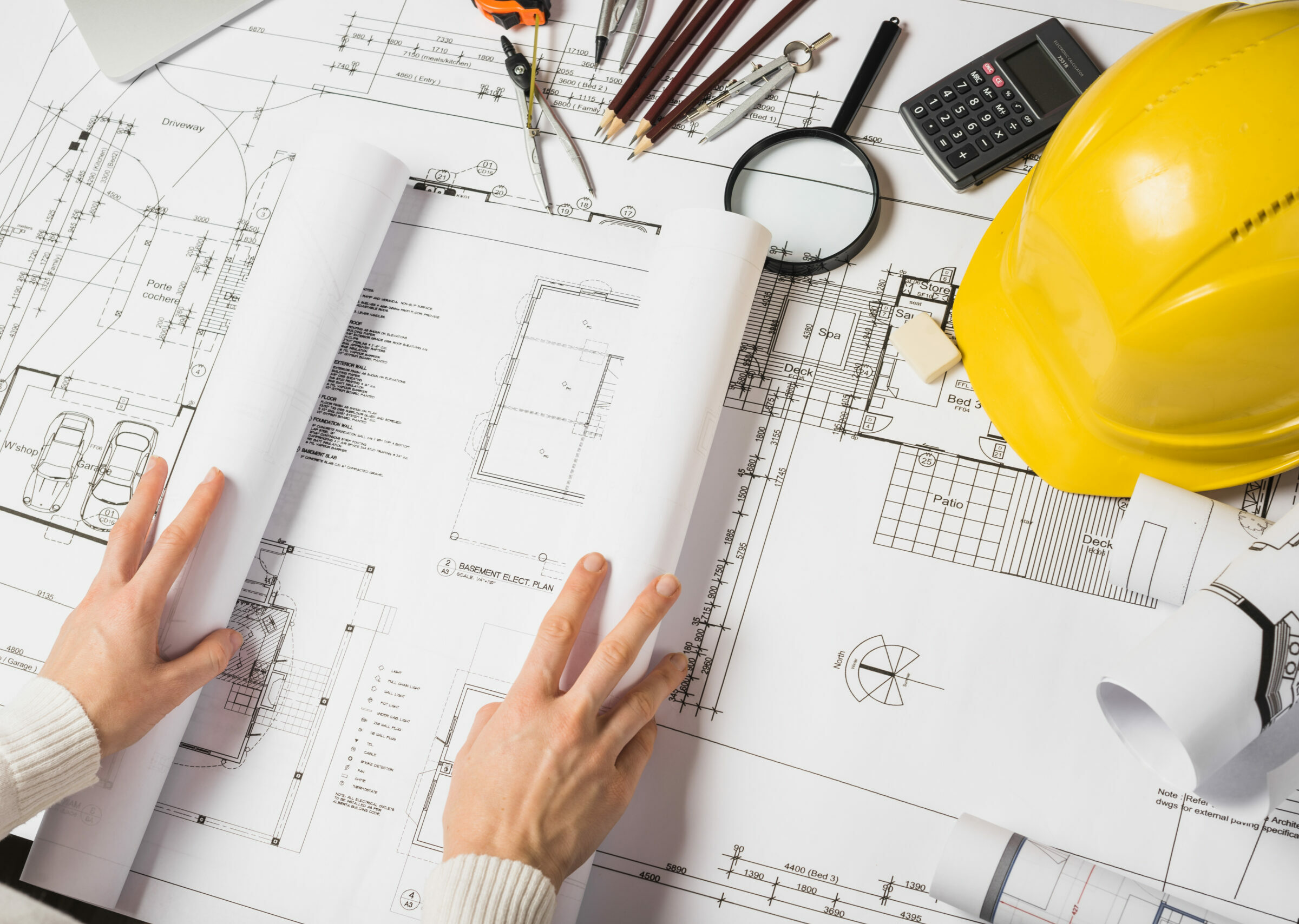 crop-architect-opening-blueprint